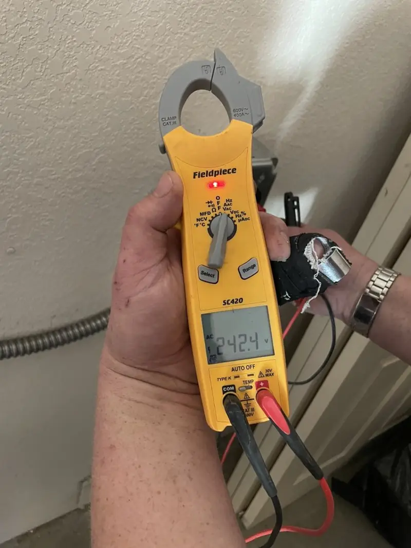 Voltage testing with clamp meter during Electrical Installation Services in Belle Haven
